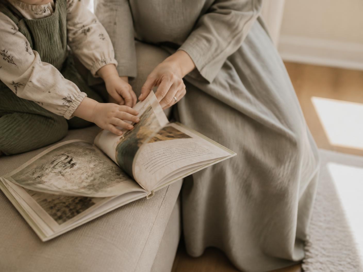 Reading a picture book together on the sofa